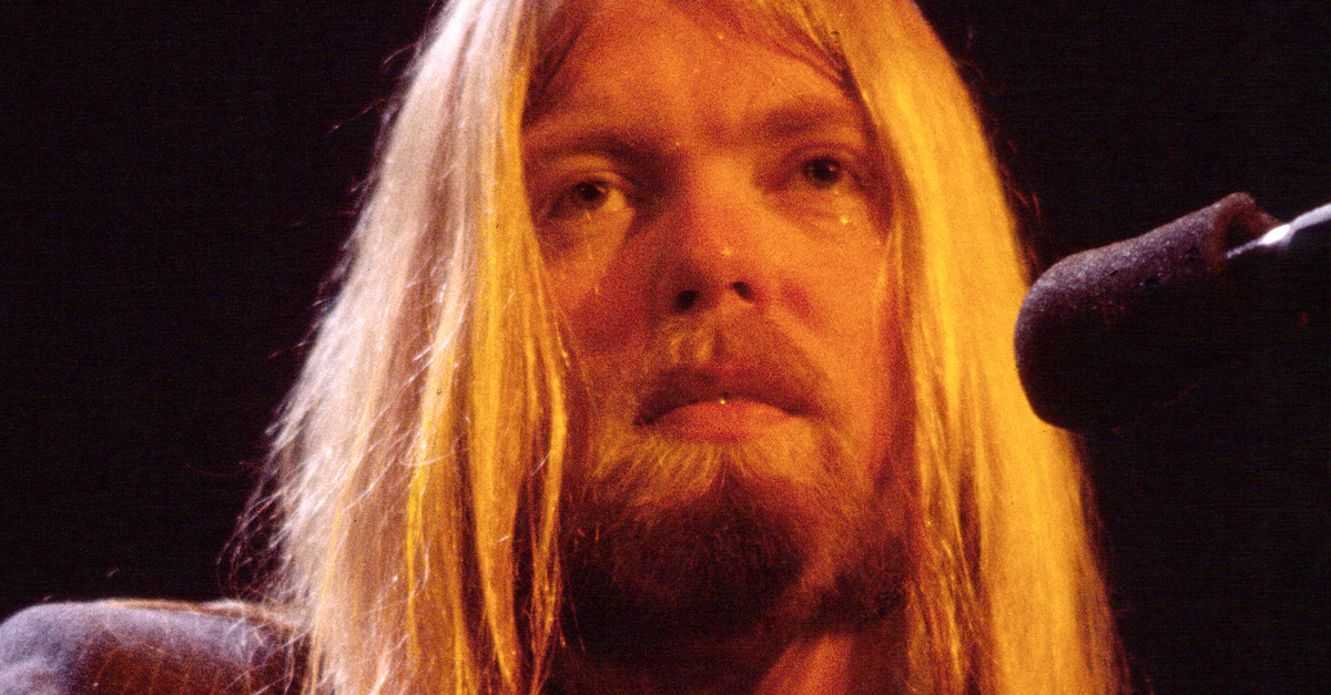 American Rock and Country musician Gregg Allman (1947 - 2017), of the Allman Brothers Band, plays guitar as he performs onstage at the Capitol Theatre, Passaic, New Jersey, December 16, 1981.