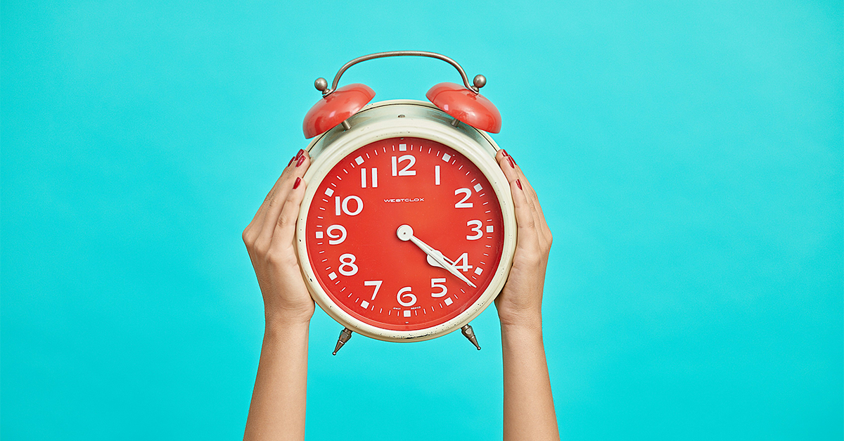 alarm clock on bright background