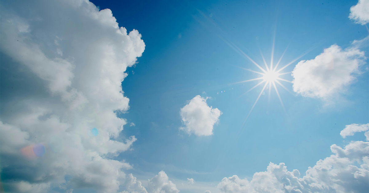 blue sky with sun and clouds