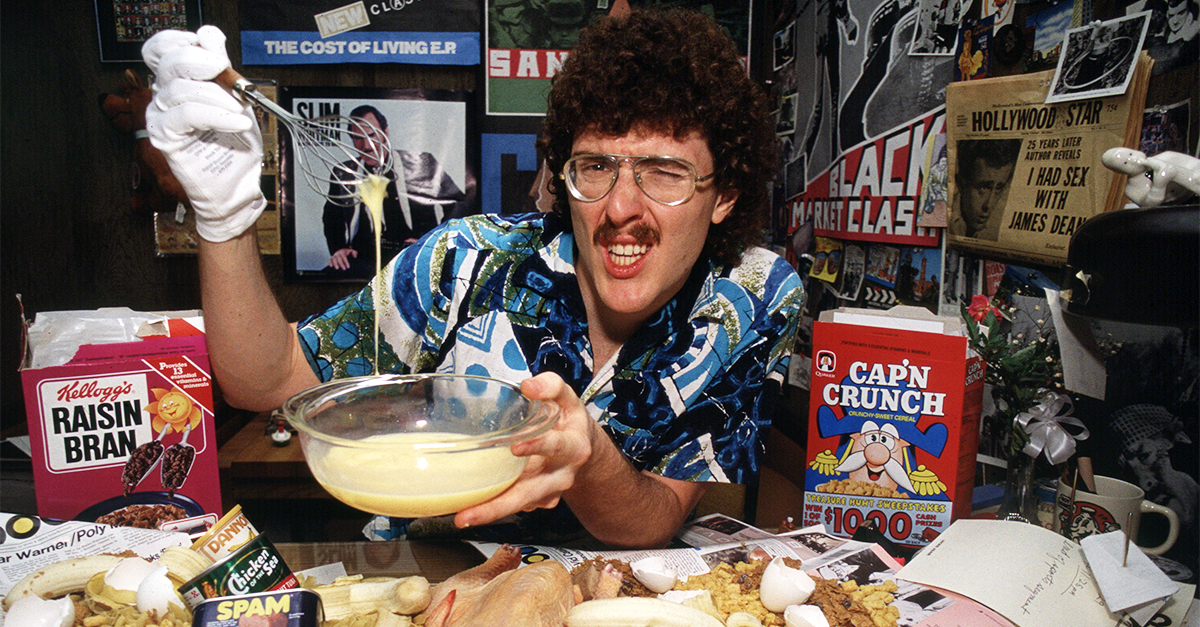 Portrait of American musician, parodist, and comedian Weird Al Yankovic as he poses with various food items during a photo shoot, March 20, 1984 in Los Angeles, California.