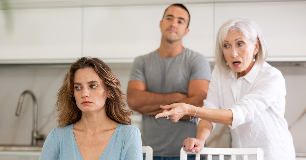 Family of three - mother-in-law, daughter and son quarreling in kitchen