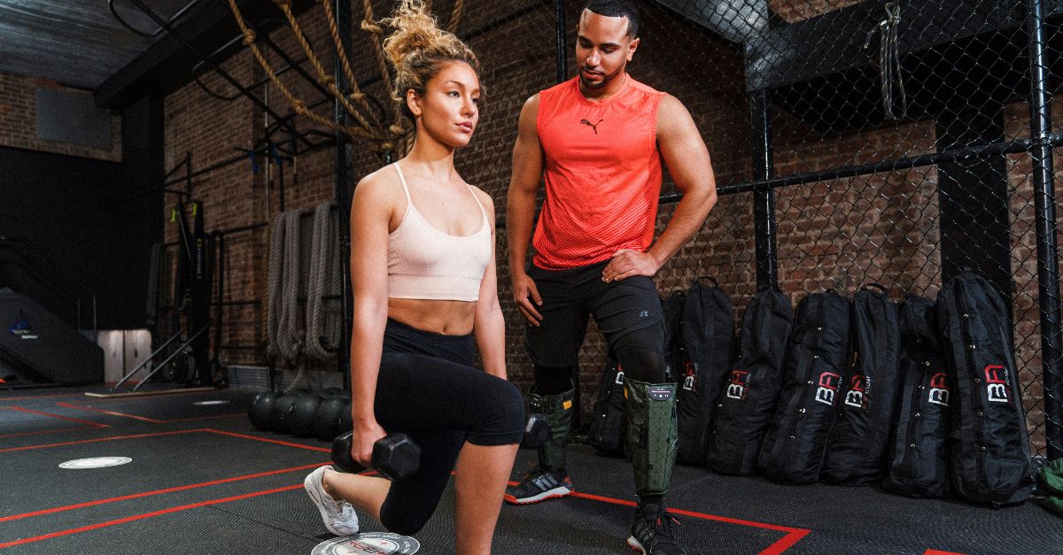 a man and a woman in a gym