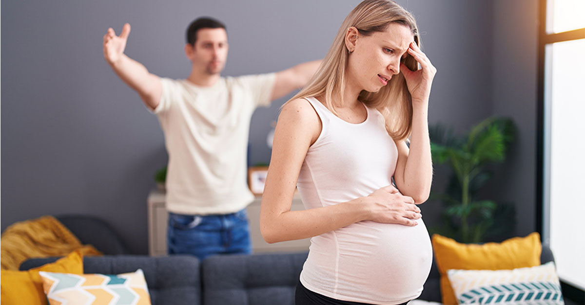 Man and woman couple expecting baby arguing at home