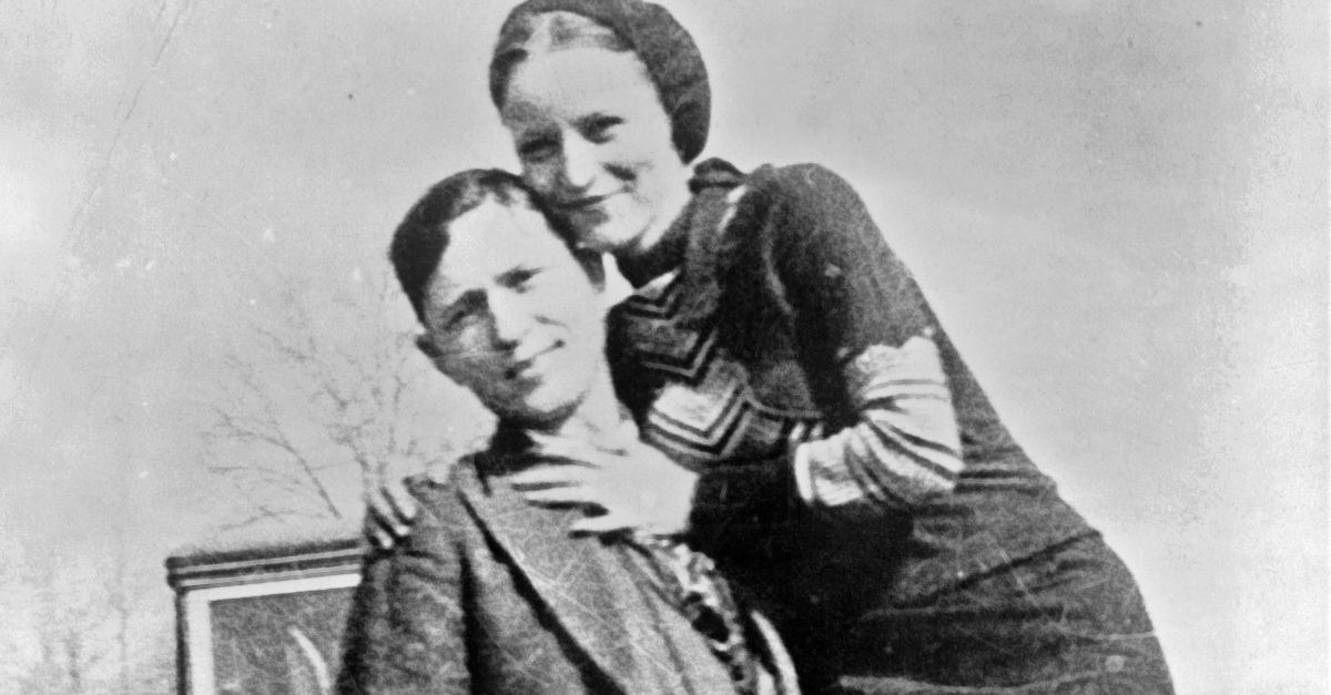 Bonnie Parker and Clyde Barrow, sometime between 1932 and 1934, when their exploits in Arkansas included murder, robbery, and kidnapping. Contrary to popular belief the two never married. They were in a longstanding relationship. Posing in front of a 1932 Ford V8 automobile. Recovered from Bonnie and Clyde after their deaths on May 23, 1934.