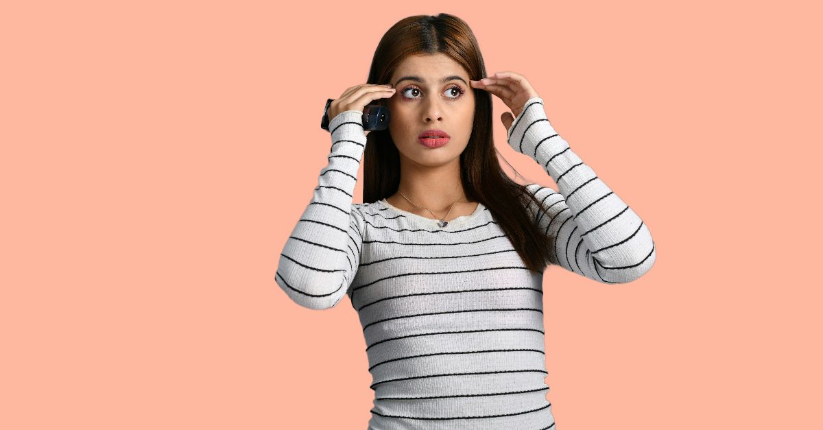 a woman holding a phone to her ear