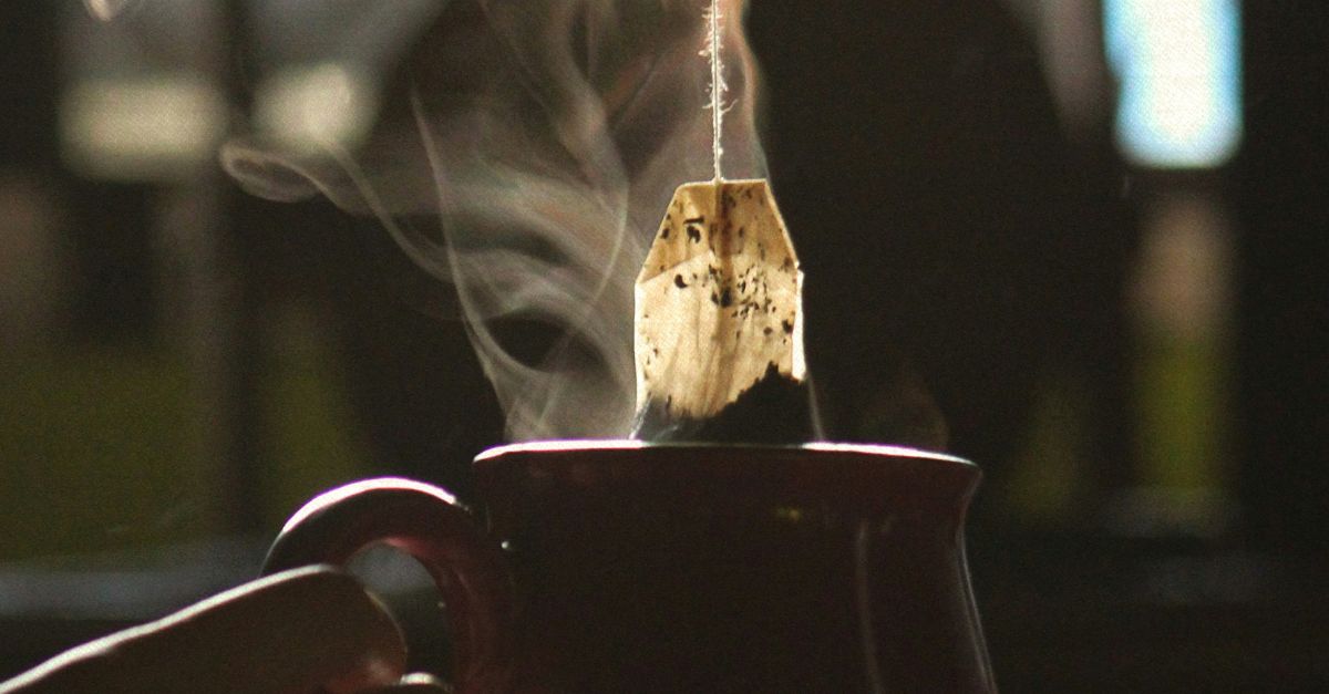 water pouring from black ceramic mug