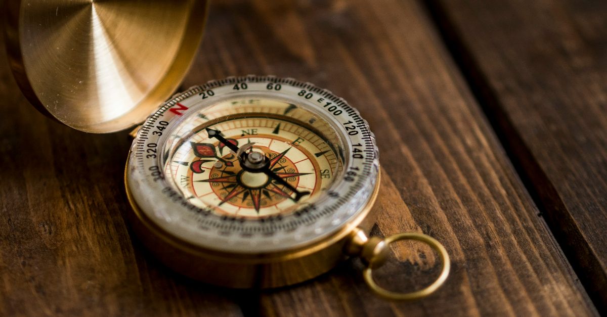 shallow focus photo of compass