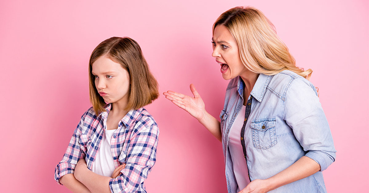 woman yelling at teen with back turned