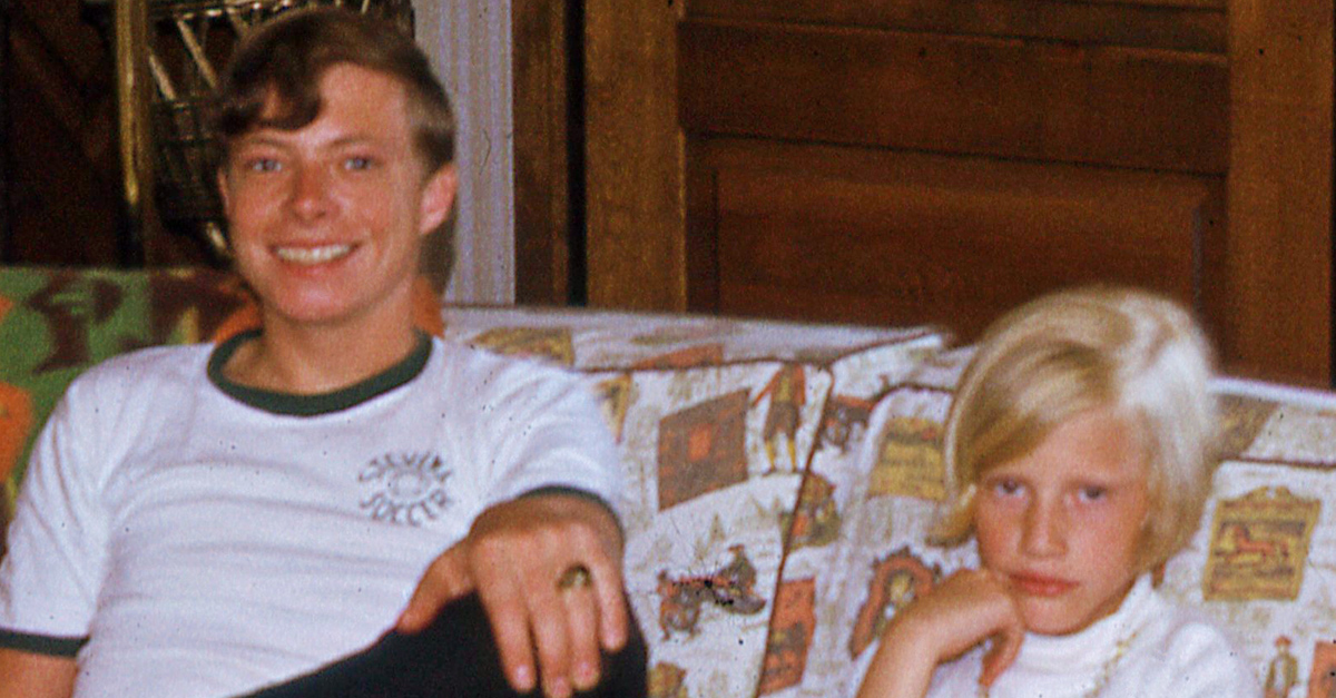 Family of children in the 1960s sitting on a couch